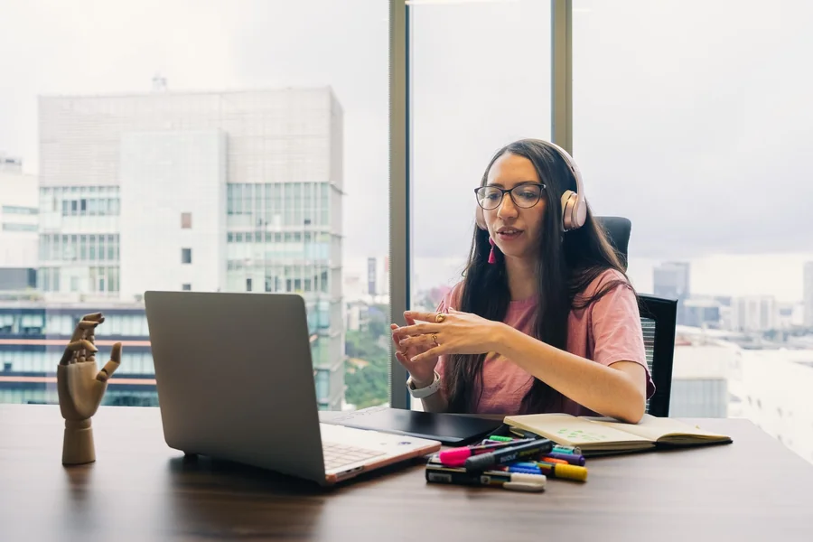 Programme coordinator on a video call with a headset