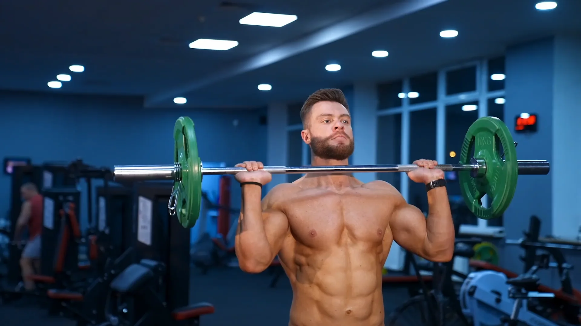 Man training with a barbell during a strength workout
