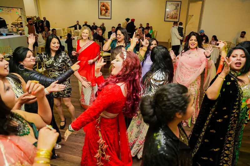 Women dancing energetically together