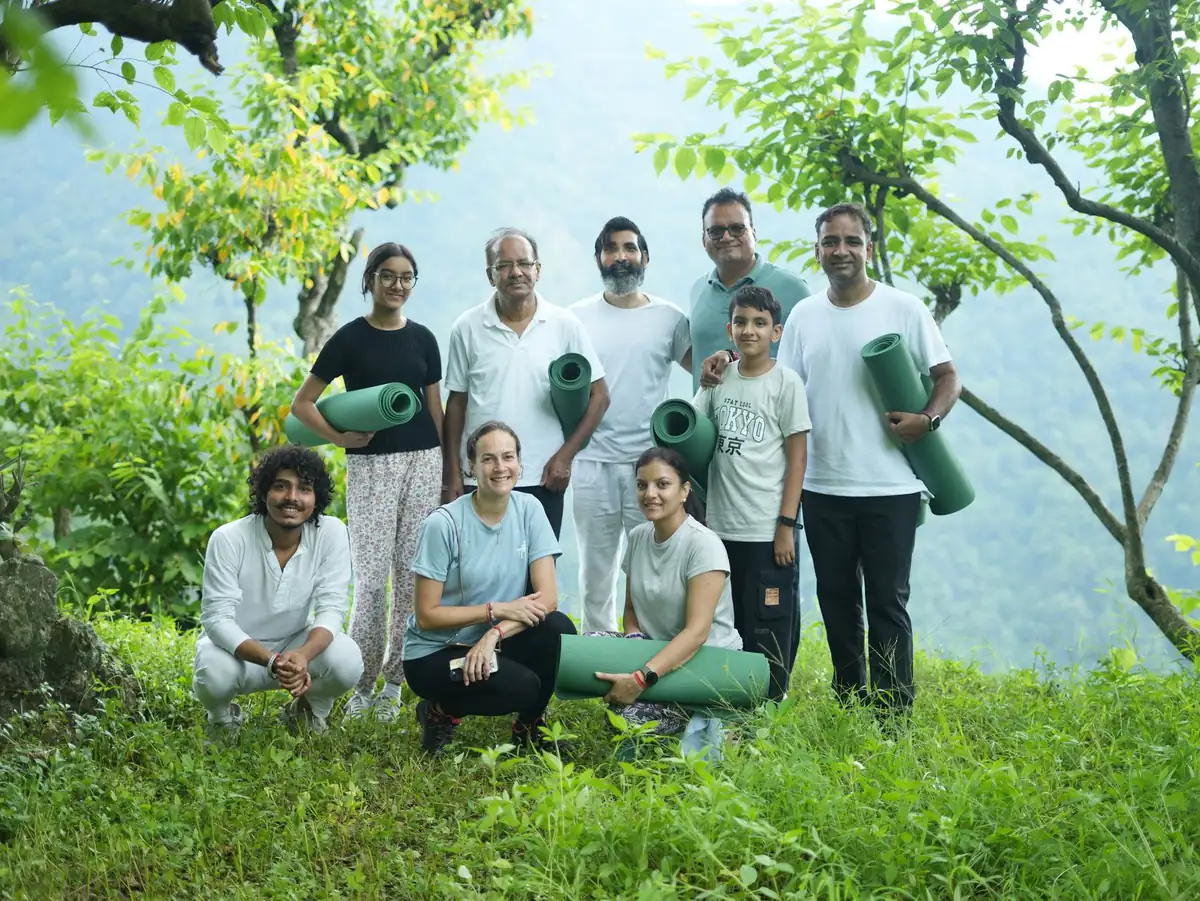 Team standing together with their yoga mats