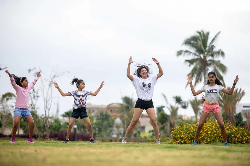 Group jumping together during a dance fitness class